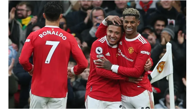 Manchester United players celebrate after scoring a goal