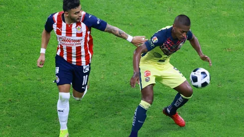 Alexis Vega attempts to steal the ball from Pedro Aquino