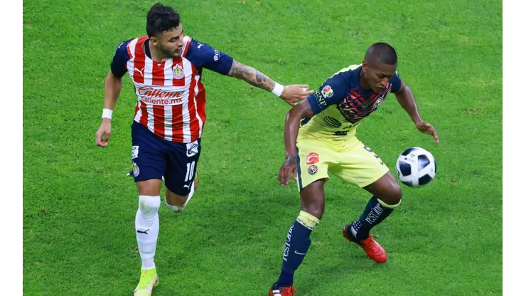 Alexis Vega attempts to steal the ball from Pedro Aquino