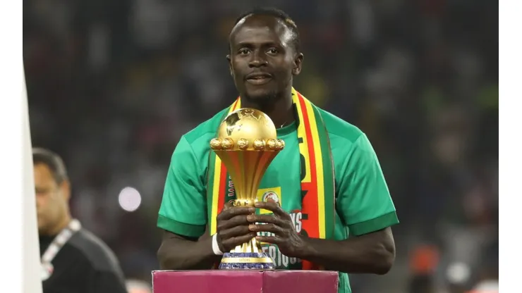 Sadio Mane with the 2021 Afcon trophy.