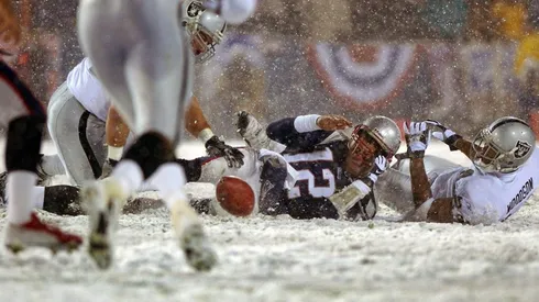 Tom Brady sacked by Charles Woodson