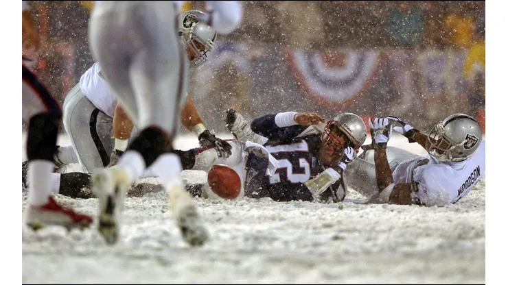 Tom Brady sacked by Charles Woodson