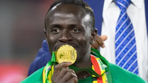 Sadio Mane kisses his medal after winning the 2021 Africa Cup of Nations with Senegal.