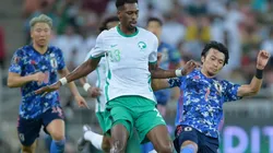 Mohamed Kanno of Saudi Arabia is tackled by Gaku Shibasaki of Japan during a Qualifier match