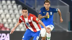 Miguel Almiron of Paraguay (left) against Roberto Firmino of Brazil.