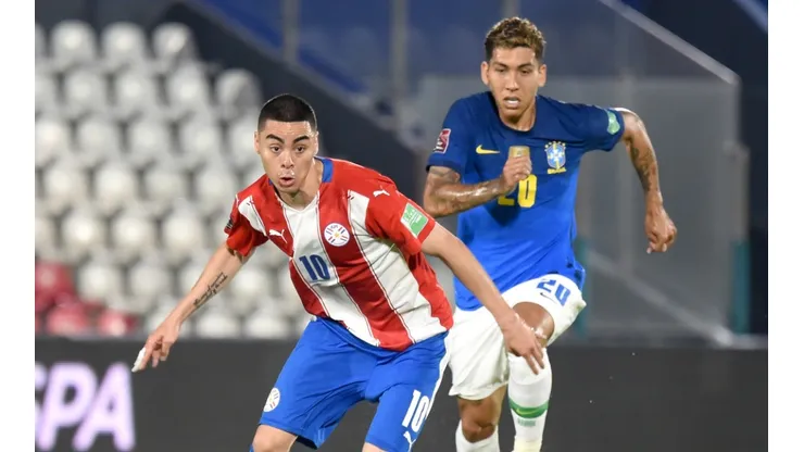 Miguel Almiron of Paraguay (left) against Roberto Firmino of Brazil.