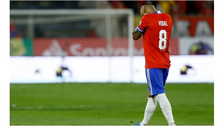 Arturo Vidal of Chile walks off the field after being sent off during a match between Chile and Ecuador