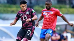 Jesus Gallardo of Mexico battles for possession with Joel Campbell of Costa Rica