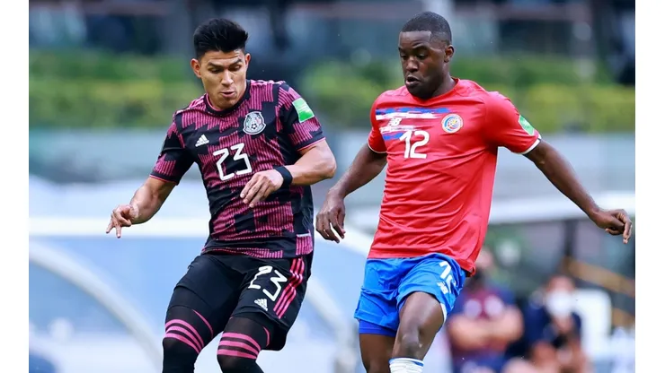 Jesus Gallardo of Mexico battles for possession with Joel Campbell of Costa Rica