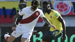 Gianluca Lapadula of Peru (left) against Davinson Sanchez of Colombia.