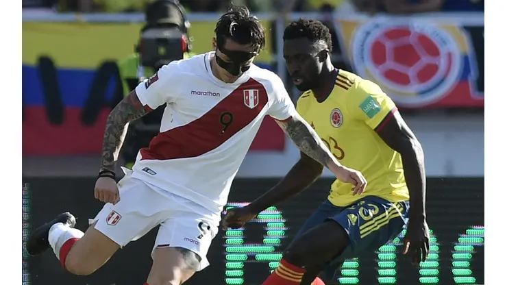 Gianluca Lapadula of Peru (left) against Davinson Sanchez of Colombia.