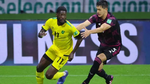 Shamar Nicholson of Jamaica battles for possesion with Cesar Montes of Mexico