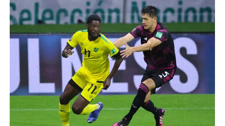 Shamar Nicholson of Jamaica battles for possesion with Cesar Montes of Mexico