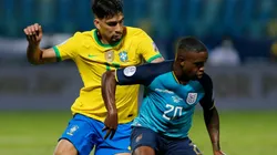 Lucas Paqueta of Brazil (left) against Sebastian Mendez of Ecuador.
