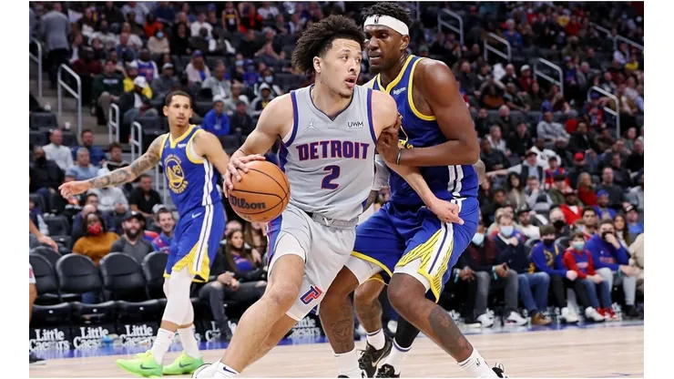 Cade Cunningham of the Detroit Pistons and Kevon Looney of the Golden State Warriors