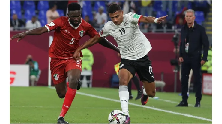 Faisal of Egypt battles for possession Ahmed Ibrahim of Sudan during The FIFA Arab Cup Qatar 2021