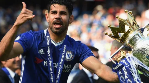 Diego Costa of Chelsea poses with the 2017 Premier League Trophy