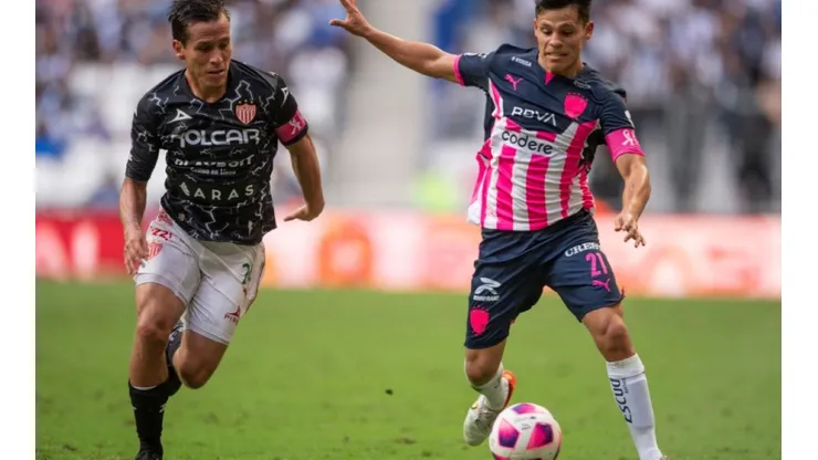 Fernando Gonzalez of Necaxa (left) fight for ball control against Arturo Gonzalez of Monterrey