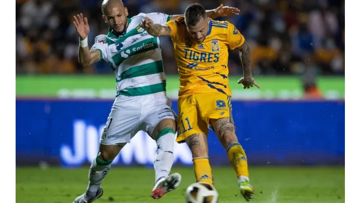 Matheus Doria of Santos (left) fight for ball control against Nicolas Lopez of Tigres