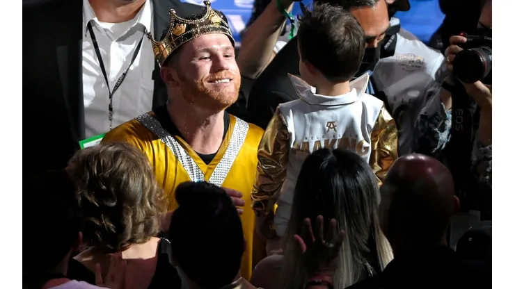 Canelo Alvarez celebrates his Unified World Super middleweight Championship with his son