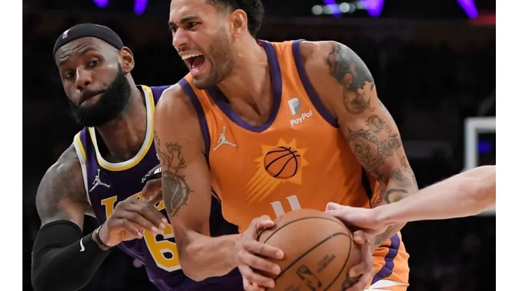 Lebron James of Lakers (left) tries to stop Abdel Nader of Suns