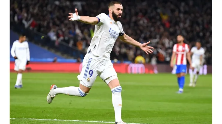 Karim Benzema celebrates scoring the opening goal agains Atletico Madrid