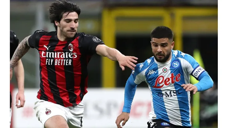 Lorenzo Insigne (R) of SSC Napoli is challenged by Sandro Tonali (L) of AC Milan.