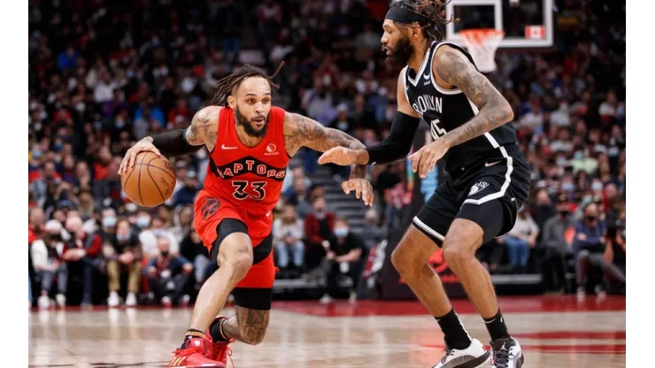 Gary Trent Jr of Raptors (left) tries to drible pass DeAndre Bembry of Nets