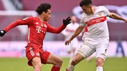 Leroy Sane of Bayern Munich (left) fights for ball possession against Marc-Oliver Kempf of Stuttgart