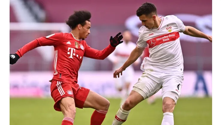 Leroy Sane of Bayern Munich (left) fights for ball possession against Marc-Oliver Kempf of Stuttgart