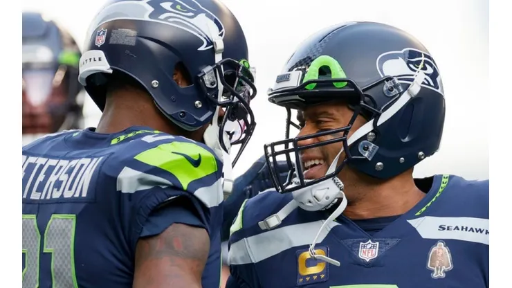 Seattle Seahawks players Adrian Peterson (left) and Russell Wilson