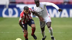 Angel Correa of Atletico Madrid (left) fights for ball control against Mendy of Real Madrid