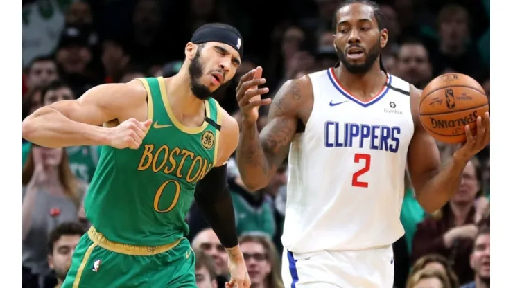 Jayson Tatum of Celtics (left) argues with Kawhi Leonard of Clippers