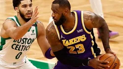 Jayson Tatum of Celtics (left) tries to block a shot from LeBron James