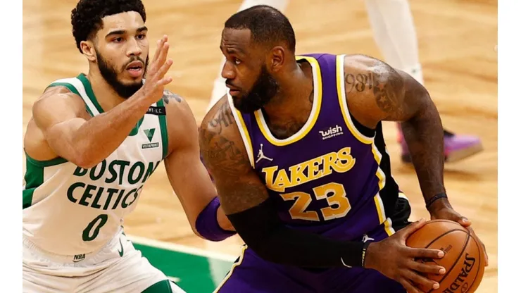 Jayson Tatum of Celtics (left) tries to block a shot from LeBron James
