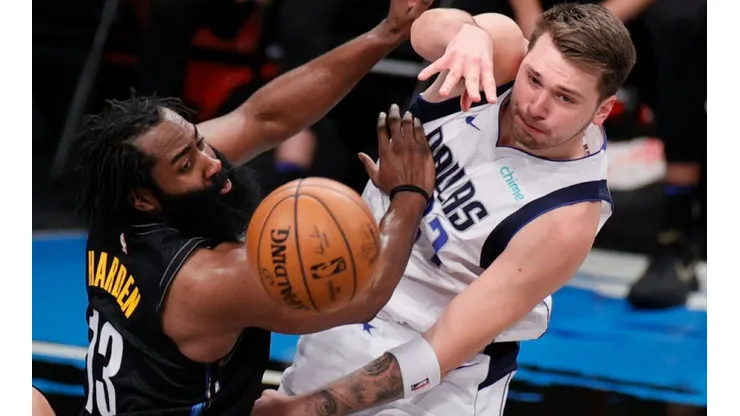James Harden of Nets (left) fights the ball possession with Luka Doncic of Mavericks