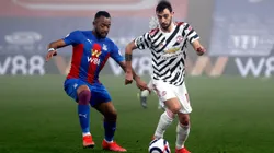 Jordan Ayew of Crystal Palace (left) fights for ball control against Bruno Fernandes of Manchester United