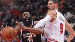 James Harden of Nets (lets) loses the ball against Nikola Vucevic of Bulls