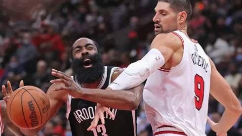 James Harden of Nets (lets) loses the ball against Nikola Vucevic of Bulls