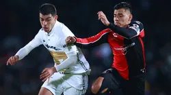 Erik Lira of Pumas UNAM (left) Aldo Rocha #26 Atlas