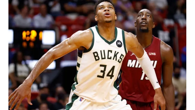 Giannis Antetokounmpo of Bucks (front) waits for a rebound with Bam Adebayo of Miami Heat