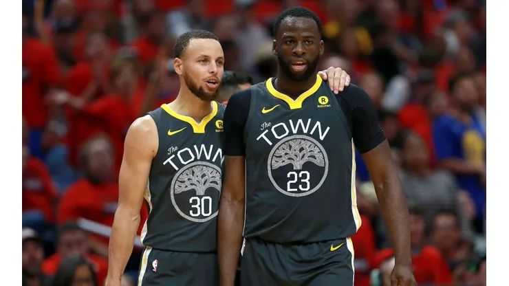 Stephen Curry (left) and Draymond Green in action for the Golden State Warriors.