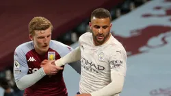 Matt Targett of Aston Villa (lef) tries to block Kyle Walker of Manchester City