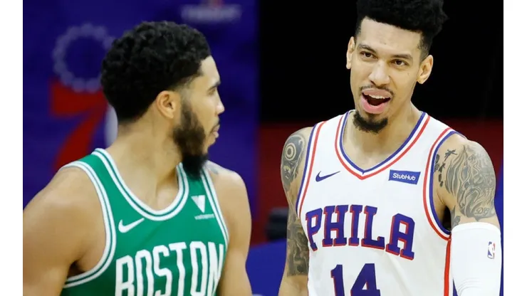Jayson Tatum of Celtics (left) exchange words after a play with Danny Green of 76ers