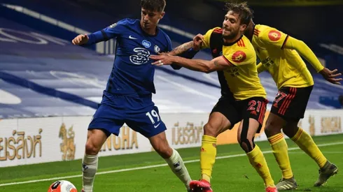 Mason Mount of Chelsea (left) tries to avoid defender Kiko Femenia of Watford