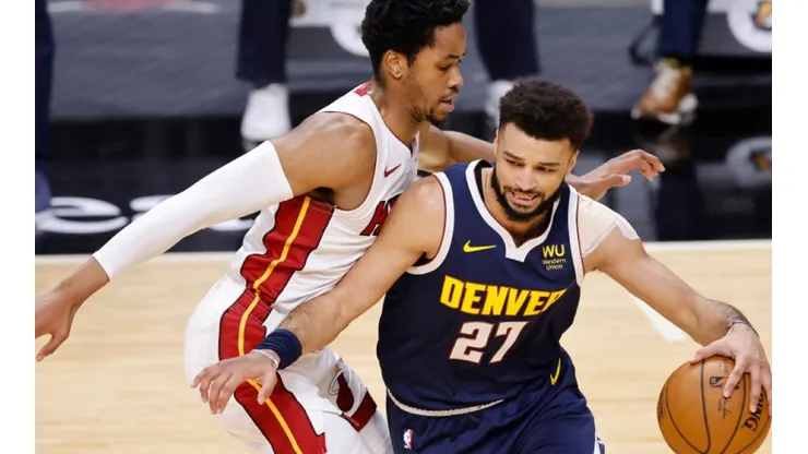 KZ Okpala of Miami Heat (left) tries to block Jamal Murray of Denver Nuggets