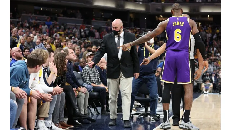 LeBron James #6 of the Los Angeles Lakers points out fans that he had a disturbance with to security during the game against the Indiana Pacers.