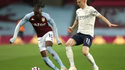 Bertrand Traore of Aston Villa (left) tries to avoid midfielder Oleksandr Zinchenko of Manchester City