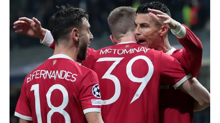 Manchester United players celebrate after scoring a goal