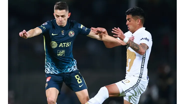 Alvaro Fidalgo of Club America (left) against Leonel Lopez of Pumas UNAM.